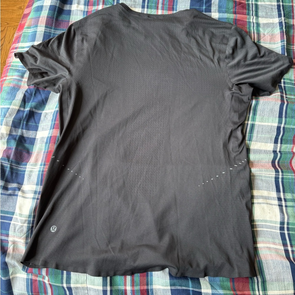 Lululemon black t shirt. Barely used and good condition. Size is XS.